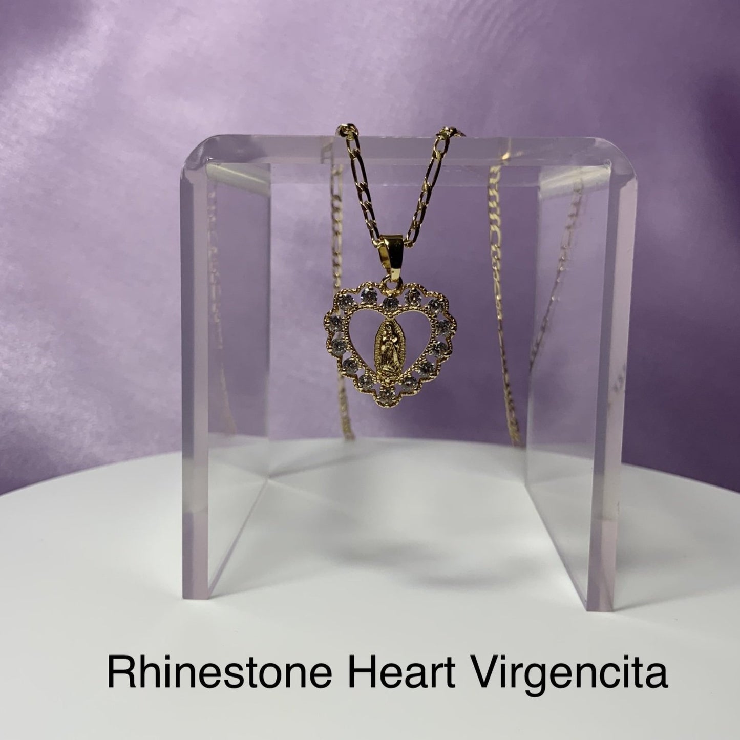Heart virgencita pendant with rhinestones on gold necklace displyed. Virgen mary jewelry. Virgen maria jewelry. Joyas virgencita. Virgencita.