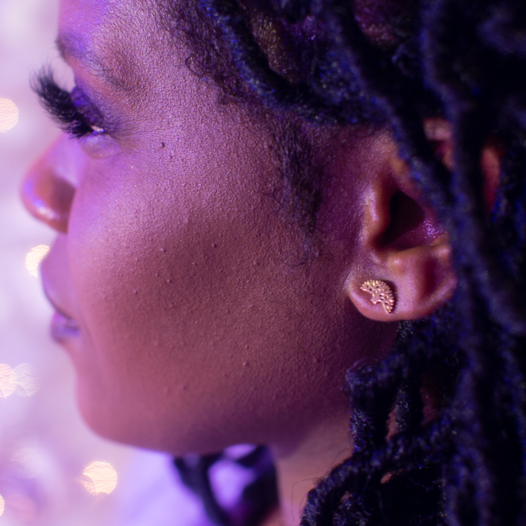 Oakland Tree Set earrings displayed on girl. Oakland Tree earrings. Oakland Tree stud earrings in gold. Oakland Tree jewelry. Oakland tree.